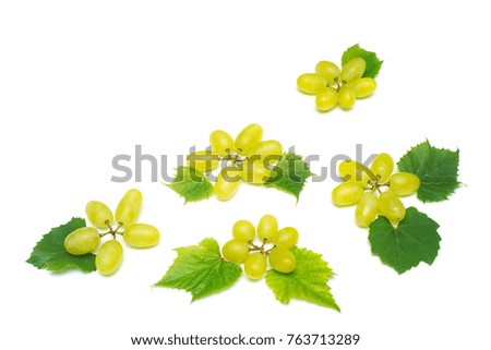 Fresh green grapes branch isolated on white background. Creative concept of fruit, butterfly shape. Flat lay, top view 
