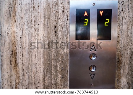 Close up modern elevator call buttons and screen