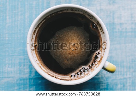 Coffee on blue rustic table background