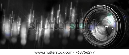 Photo lens with original background with fuzzy flashes of street lights at night - black and white