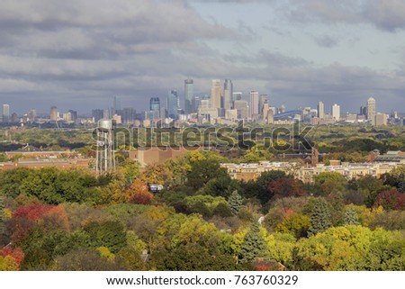 A Telephoto Shot Compressing Minneapolis Skyline and Early Fall Landscape on a Windy and Cloudy Day