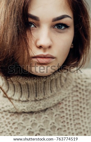 portrait of cute beautiful young girl with freckles close-up