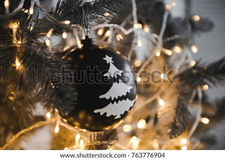 Merry Christmas and New Year Background. Close Up Decorates the Balls Hanging on the Christmas Tree. Christmas decoration ball on Christmas tree branch. Background with space for text.