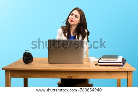 Business woman working with her laptop and thinking on colorful background