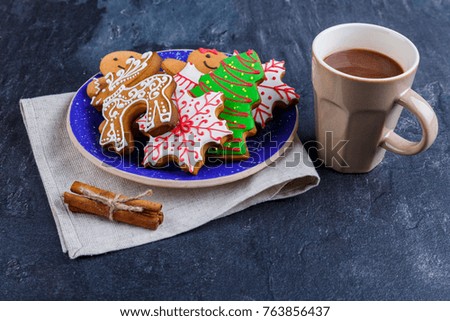 Plate with cookies on a napkin and a cup of hot chocolate close-up