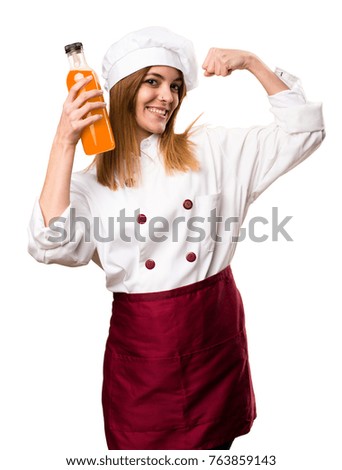 Happy Beautiful chef woman holding an orange juice