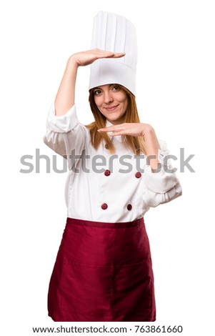 Beautiful chef woman holding something
