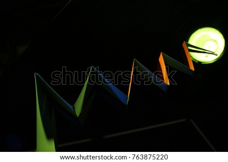 Paper staircase, laser-cut or with scissors, white cardboard or folded paper on the black-and-white background. The original design in origami style and work with light. Screensaver for your desktop.
