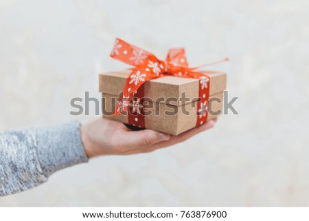Man presents a Christmas box