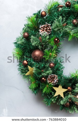 Holidays new year concept. Advent christmas door wreath with festive decoration on a cozy background. Flat lay top view