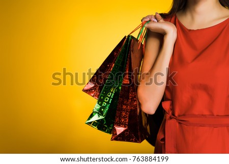 girl in red dress after shopping and black Friday