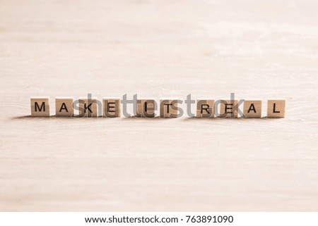 keep it real phrase collected of wooden elements with the letters