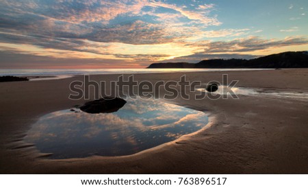 Caswell Bay Sunset Royalty-Free Stock Photo #763896517