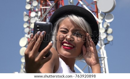 Woman Taking Selfie At Cell Tower