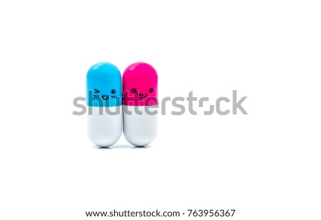 Cute capsule pills isolated on white background. Pharmacy drugstore background. Blue-white and pink-white capsule pills. Pharmacy shop. Global healthcare concept. Pharmaceutics concept. Couple life.