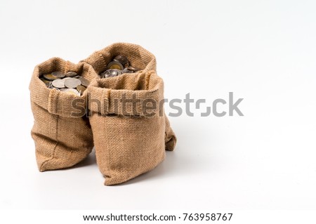 3 sacks of money bags made from hemp sack full with coins isolate on white background with empty copy space.
