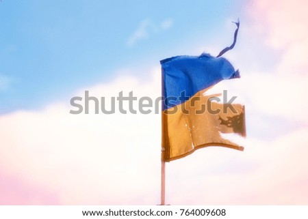 The torn Ukrainian flag
