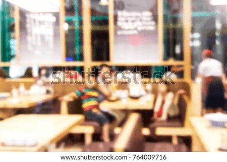 Blur image of eating between family, use for background.