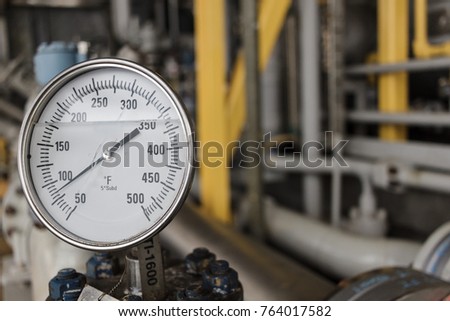 Thermometer, Temperature gauge or temperature indicator reading eighty five Fahrenheit (°F) in offshore oil and gas refinery process operation industry. Royalty-Free Stock Photo #764017582