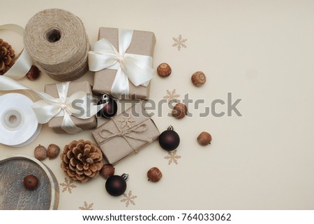 Christmas Gift boxes Rustic Style, and Eco Decorations. Pinecones, Nuts, snowflakes. Copy Space.