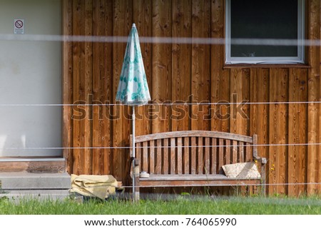 rural architecture of countryside building with roof solar and outdoor objects in july summer day in south germany