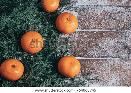 Christmas background  with tangerines, walnuts, hazelnuts