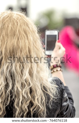 Girl with white hair shoots on the phone