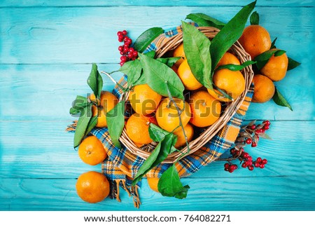 Christmas and New Year's composition with fresh tangerines, Happy New Year and Merry Christmas. Selective focus.