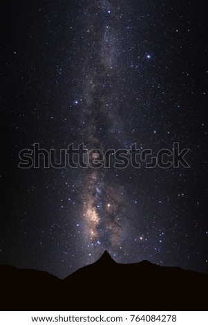Landscape silhouette of high moutain and milky way galaxy with stars and space dust in the universe