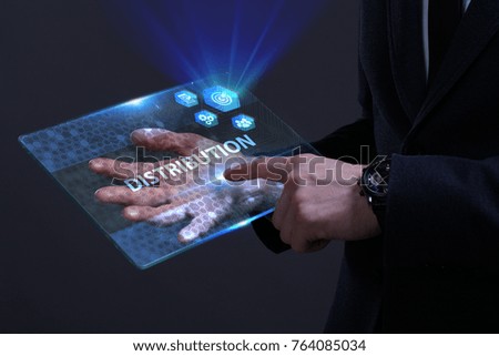 Business, Technology, Internet and network concept. Young businessman working on a virtual screen of the future and sees the inscription: Distribution