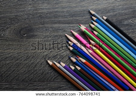 Coloured pencils isolated on the black background