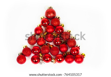 Christmas tree made from small red Christmas balls on white background