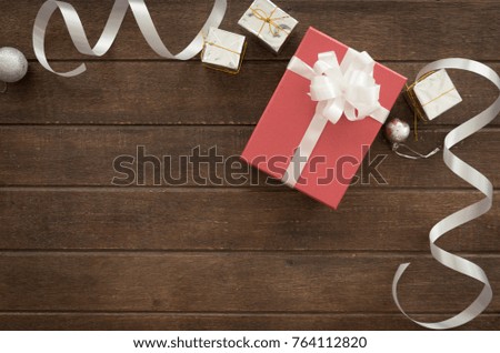 gift boxes of present for new year, christmas, birthday or anniversary on wood background. above view