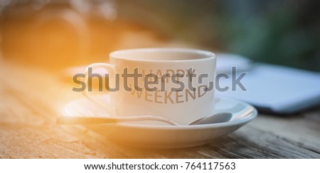 Happy Weekend coffee cup at office background or student workplace. E-learning, self-education concept