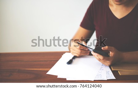 Close up of Hand holding pen, it's like a letter writer. Creative idea of work 2019 goals, writing, drawing,making notes in document.Business,investment,concept,Vintage ,Retro natural mood style.