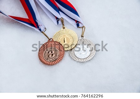 Medal, Award, Winning. White, snow background. Winter olympic game. South Korea 2018. Royalty-Free Stock Photo #764162296