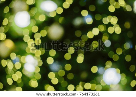 Blurred and bokeh of Christmas lighting in full screen background.