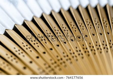 Detailed picture of the arms of a wooden fan, abstract impression, suitable as background