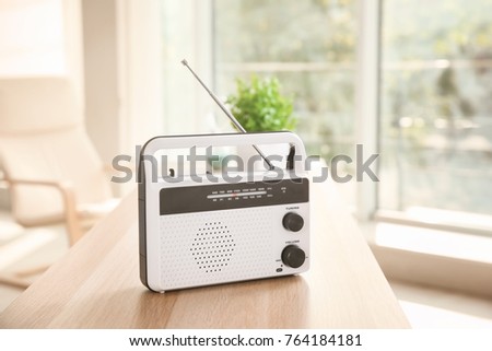 Retro style radio on table indoors