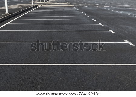 Empty parking lot outdoor with white marking lines