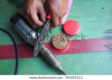 Hot air blower under maintenance.; Peel the wiring of the hot air blower with Wire Stripping Tool. 