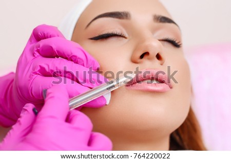Procedure filler injection in beauty clinic. Royalty-Free Stock Photo #764220022