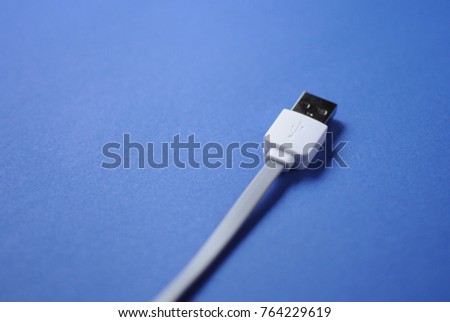 USB cable on classic blue color of the year 2020 pantone background