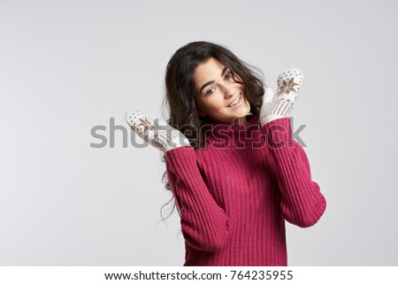 woman in sweater and mittens, winter                               