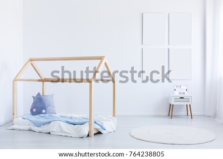 Mockup of empty posters in boy's interior with blue accent on wooden bed