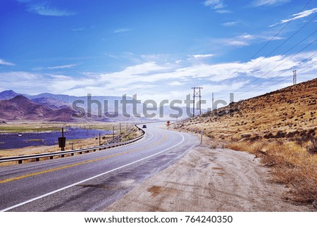 Highway in the Death Valley, travel adventure concept, color toned picture. USA. 