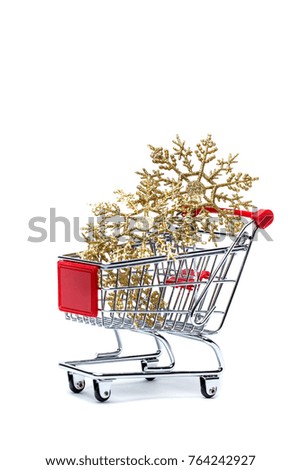 Photo of shopping cart with golden snowflakes on empty white background.