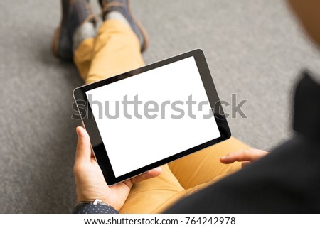 Man using tablet computer.