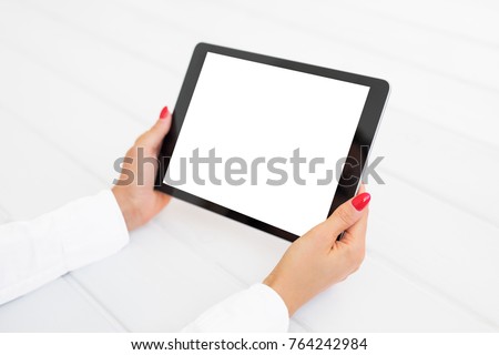 Woman holding digital tablet in horizontal position. Screen mockup.