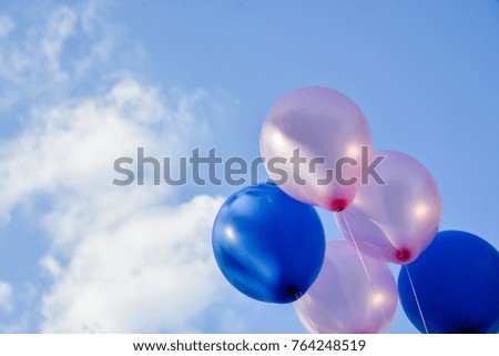 Bunch of party balloons against sky